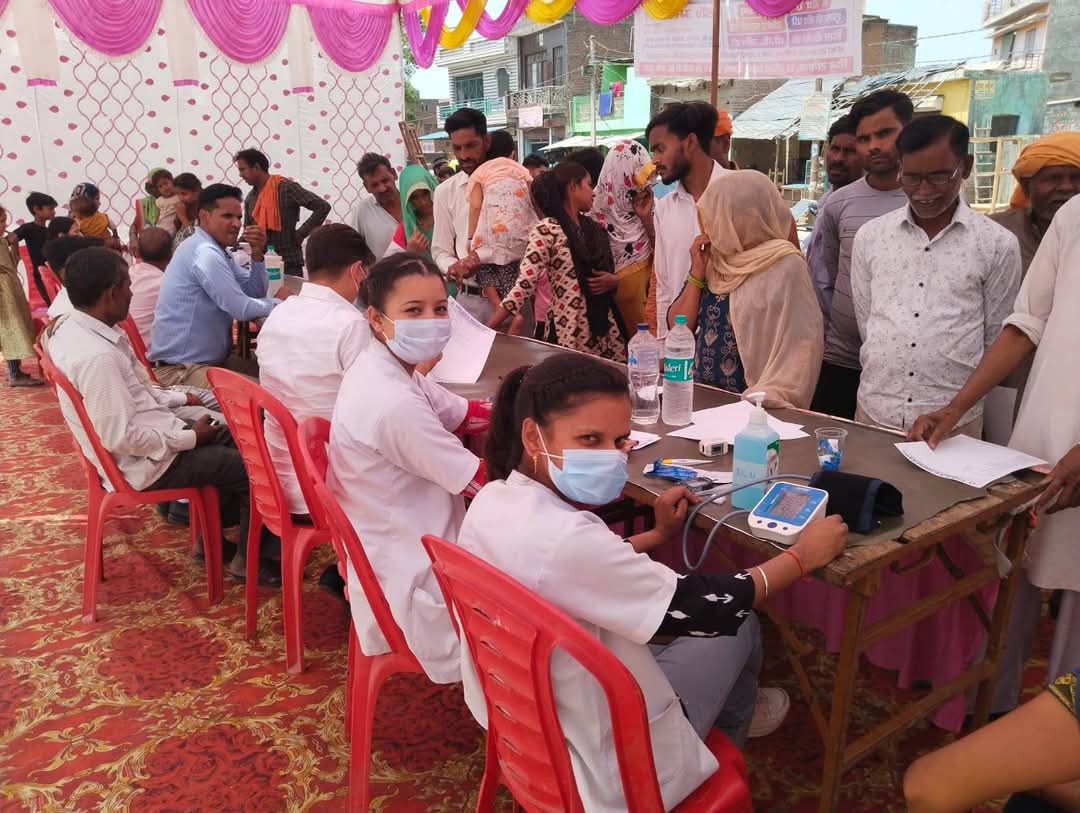 Nursing staff registering village women and elders for health tests